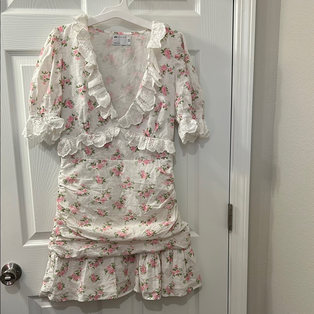 ASOS White floral mini dress with eyelet ruffle detail.
